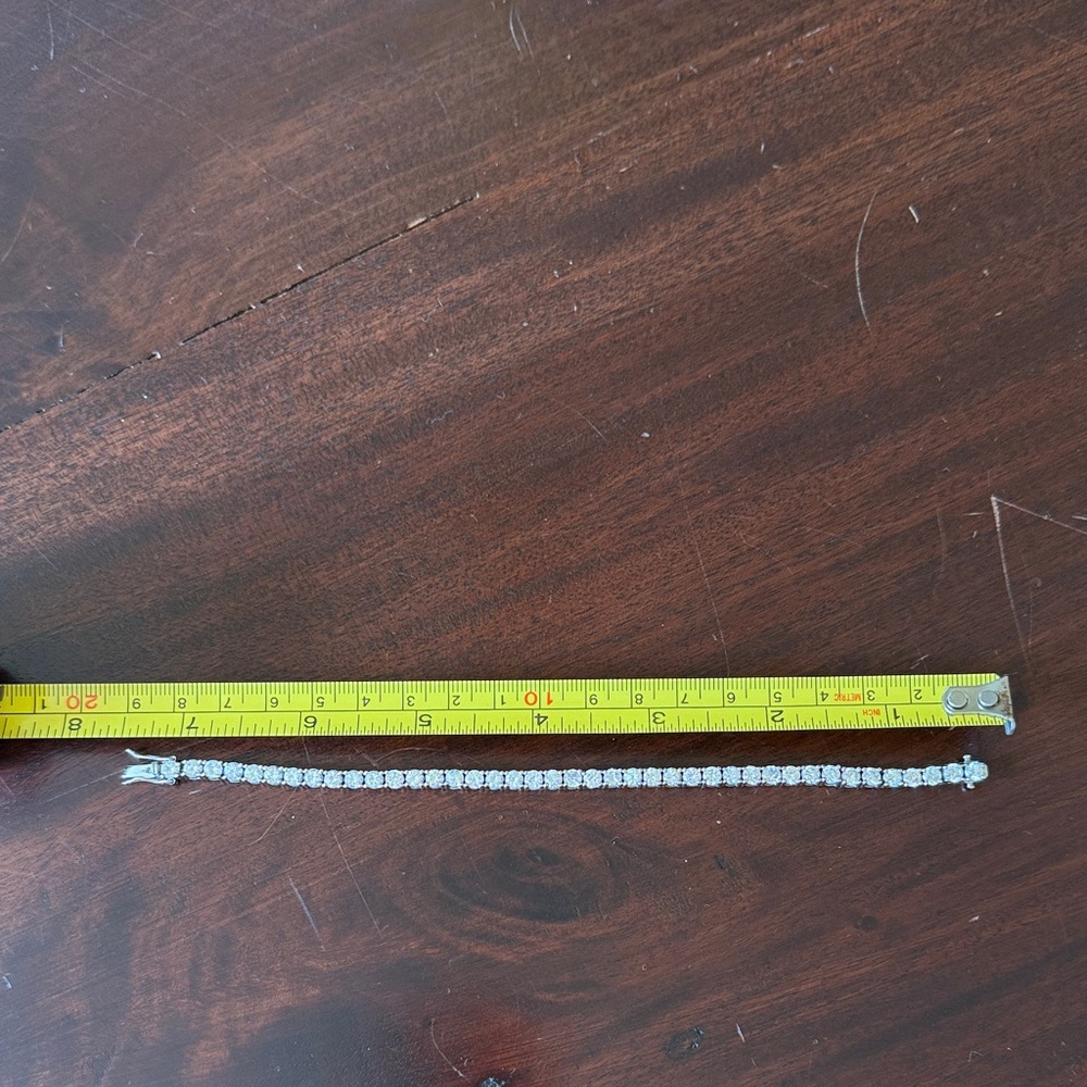 Nadri Elegant Silver Tennis Bracelet 7.25”. excellent condition.